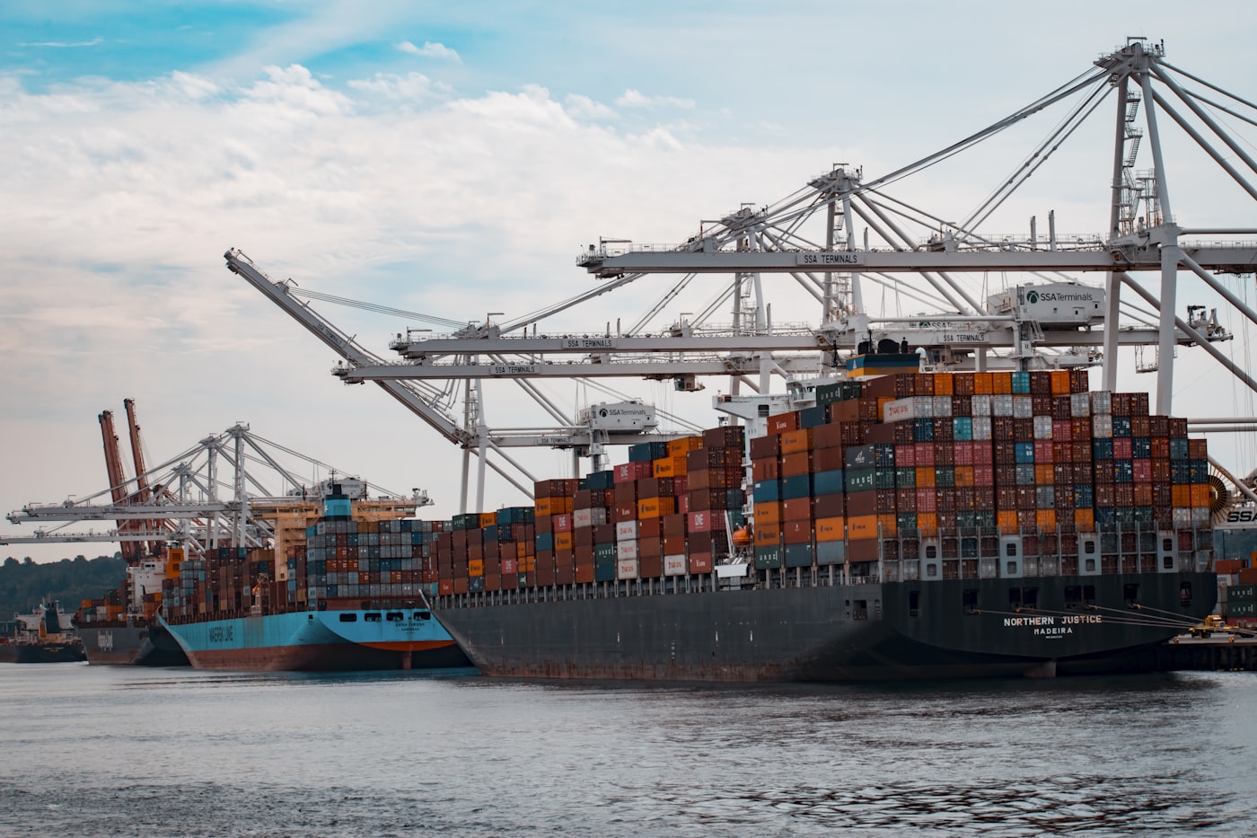Container ship loaded with coloured shipping containers